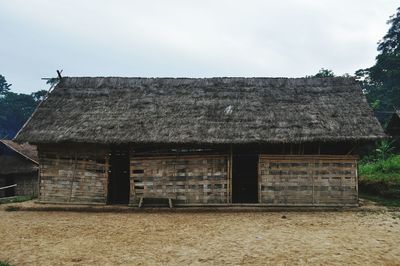 Exterior of abandoned house against sky