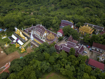 High angle view of buildings and trees in city