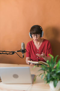 Woman podcasting at studio