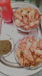 Close-up of hand in plate on table