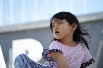 Portrait of cute girl looking away