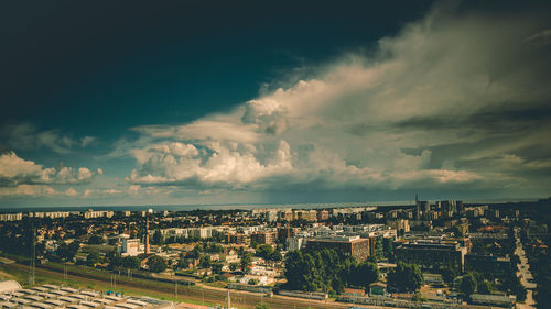 High angle view of city buildings against sky