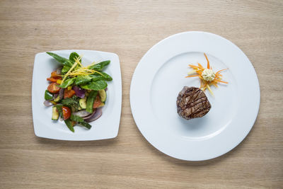 High angle view of vegetables in plate on table