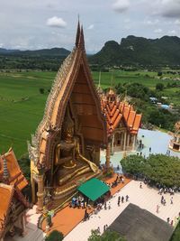 Statue of temple against cloudy sky
