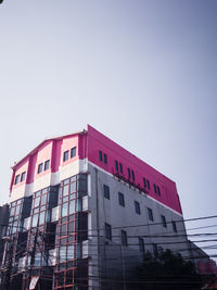 Low angle view of modern building against clear sky