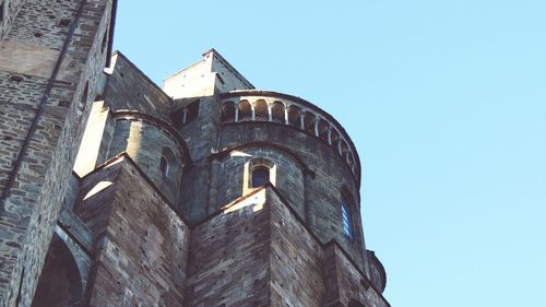 Low angle view of built structure against clear blue sky