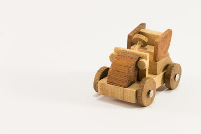Wooden cart against white background