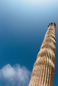 Low angle view of buildings against blue sky