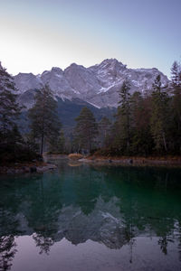 Scenic view of lake and mountains against sky