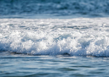 Sea waves splashing on shore