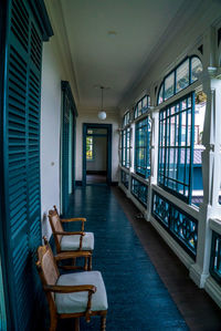 Empty chairs and tables in building