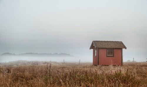 House on field against sky