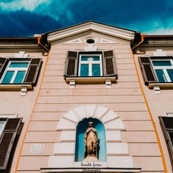 Low angle view of statue against building
