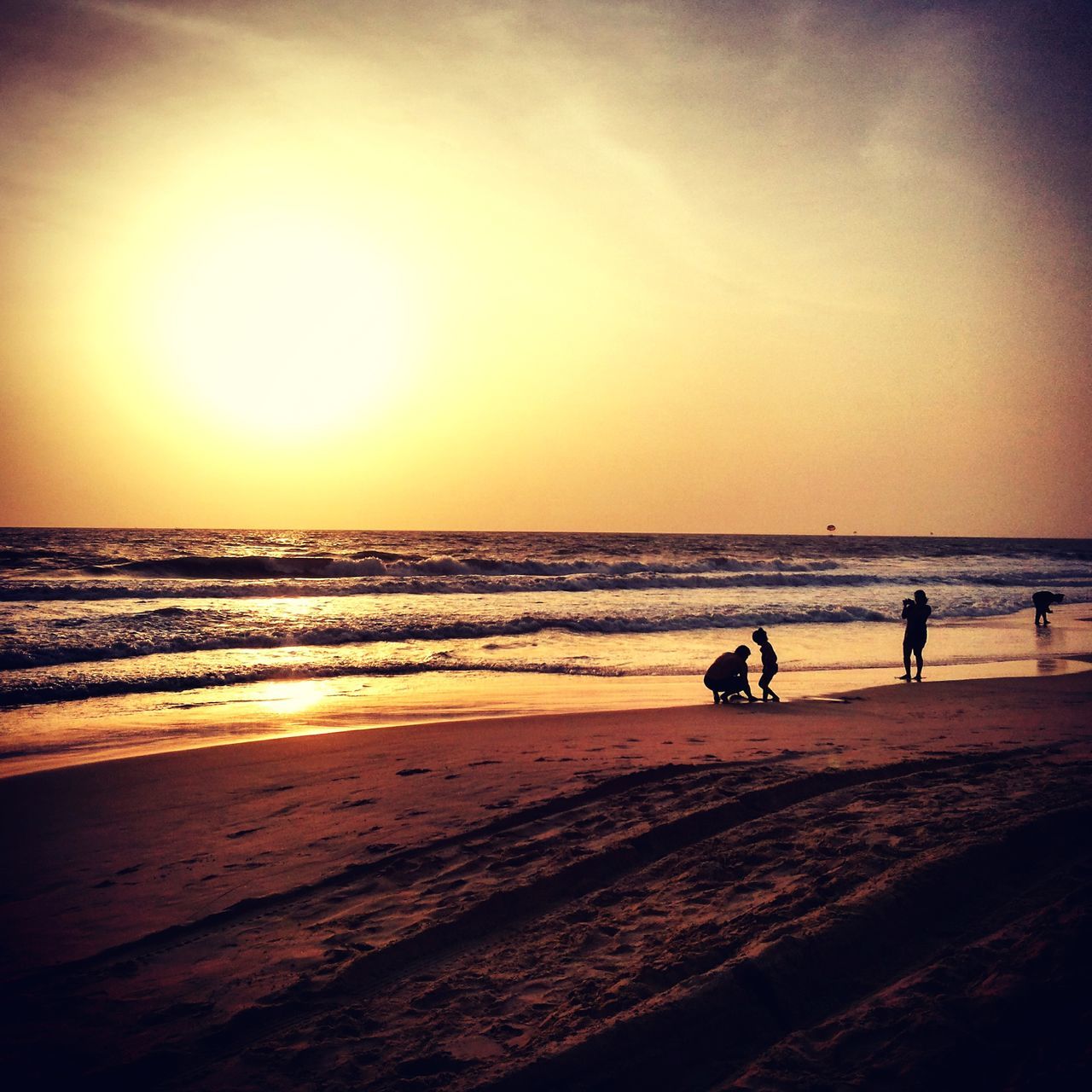 sea, beach, horizon over water, sunset, water, shore, scenics, beauty in nature, silhouette, tranquil scene, leisure activity, orange color, sand, sun, tranquility, sky, lifestyles, nature, vacations