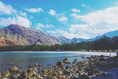 Scenic view of lake and mountains against sky