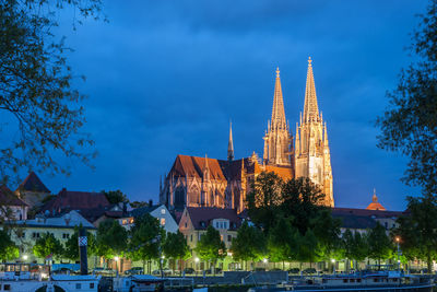 View of illuminated building against sky