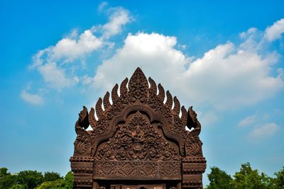 Low angle view of statue against sky