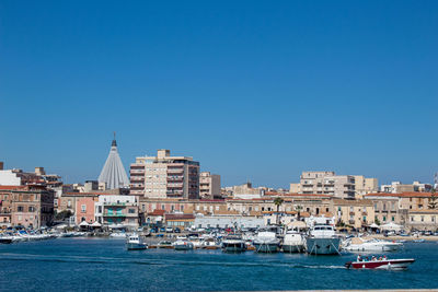 The maritime part of siracusa, with tourists on a trip to its waters