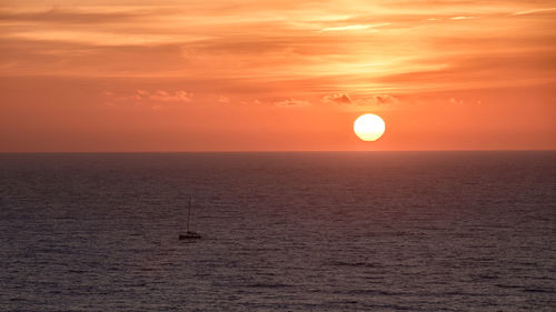 Scenic view of sea at sunset