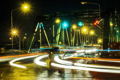 Light trails on road in city at night