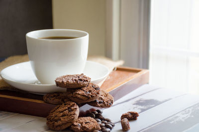 Close-up of coffee cup on table