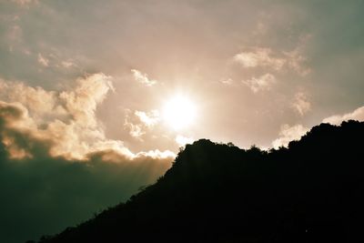 Low angle view of silhouette trees against sky during sunset