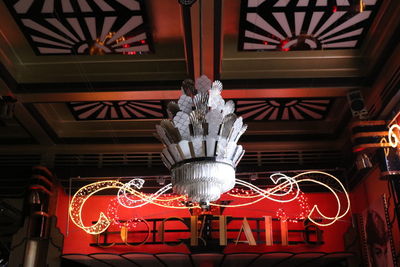 Low angle view of illuminated lanterns hanging at night