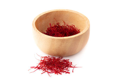 Close-up of red chili pepper against white background