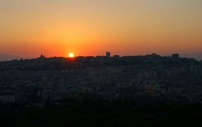 Silhouette of city at sunset