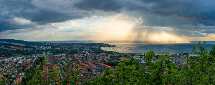 Panoramic view of townscape by sea against sky