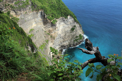 Scenic view of sea against mountain