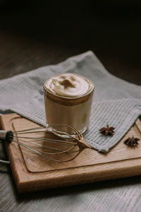 A glass of the popular trendy drink dalgona coffee with milk. whisk and ice. high quality photo