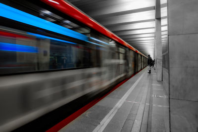 Blurred motion of train at railroad station platform