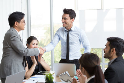 Friends standing on table