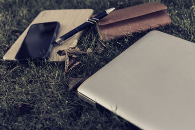 High angle view of paper on grass