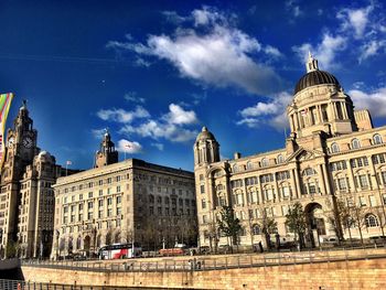 Low angle view of building against cloudy sky