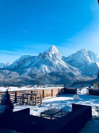 Scenic view of snowcapped mountain against blue sky