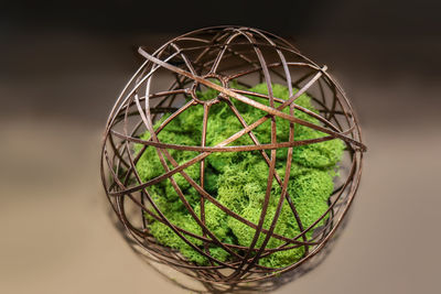 Close-up of glass ball in basket