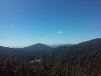 Scenic view of mountains against clear blue sky