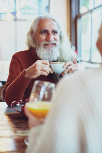 Portrait of man drinking glasses