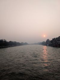 Scenic view of sea against clear sky during sunset
