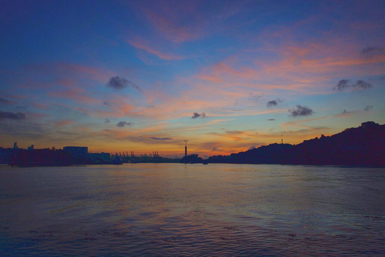 sunset, water, sky, waterfront, scenics, tranquil scene, tranquility, beauty in nature, nature, cloud - sky, idyllic, rippled, orange color, cloud, outdoors, no people, calm, blue, ocean, non-urban scene, dark