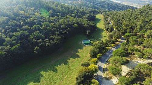 High angle view of green landscape against sky