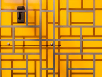 Full frame shot of yellow metal gate
