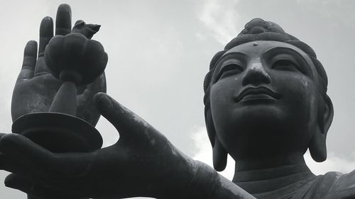 Low angle view of statue against sky