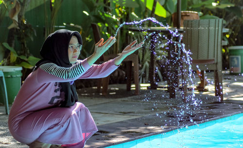 Side view of woman in swimming pool