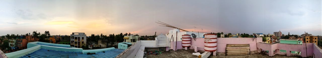 Panoramic view of buildings against sky during sunset