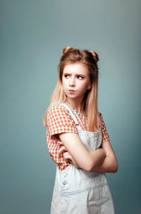 Portrait of a beautiful young woman over white background