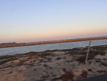 Scenic view of beach against clear sky