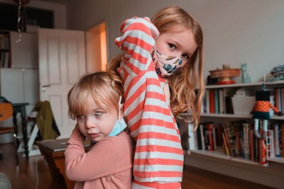 Portrait of mother and daughter at home